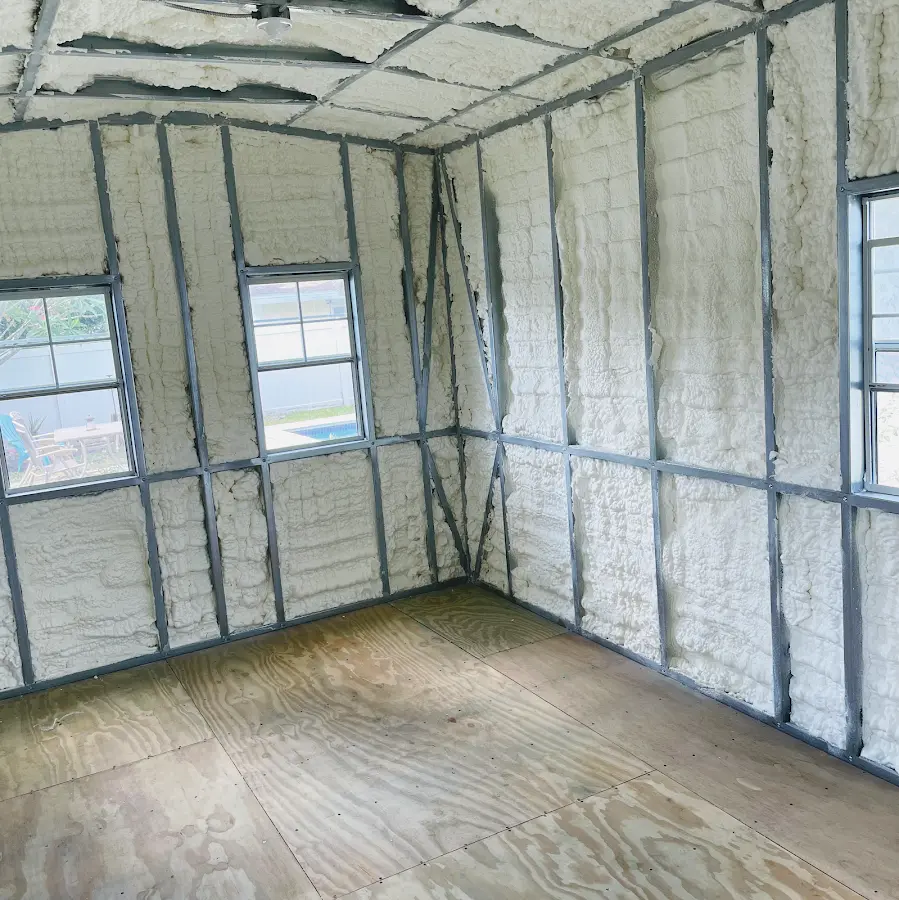 Closed-cell spray foam insulation applied to wall cavities in a residential project in Geneva
